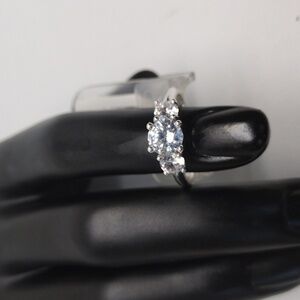 Elegant Silver Tone Ring with Sparkling Clear Gemstone - Size L